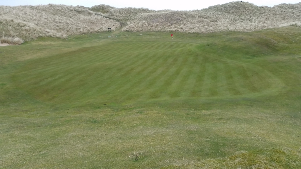 The 10th green after a fresh cut on a freezing cold Monday in April.